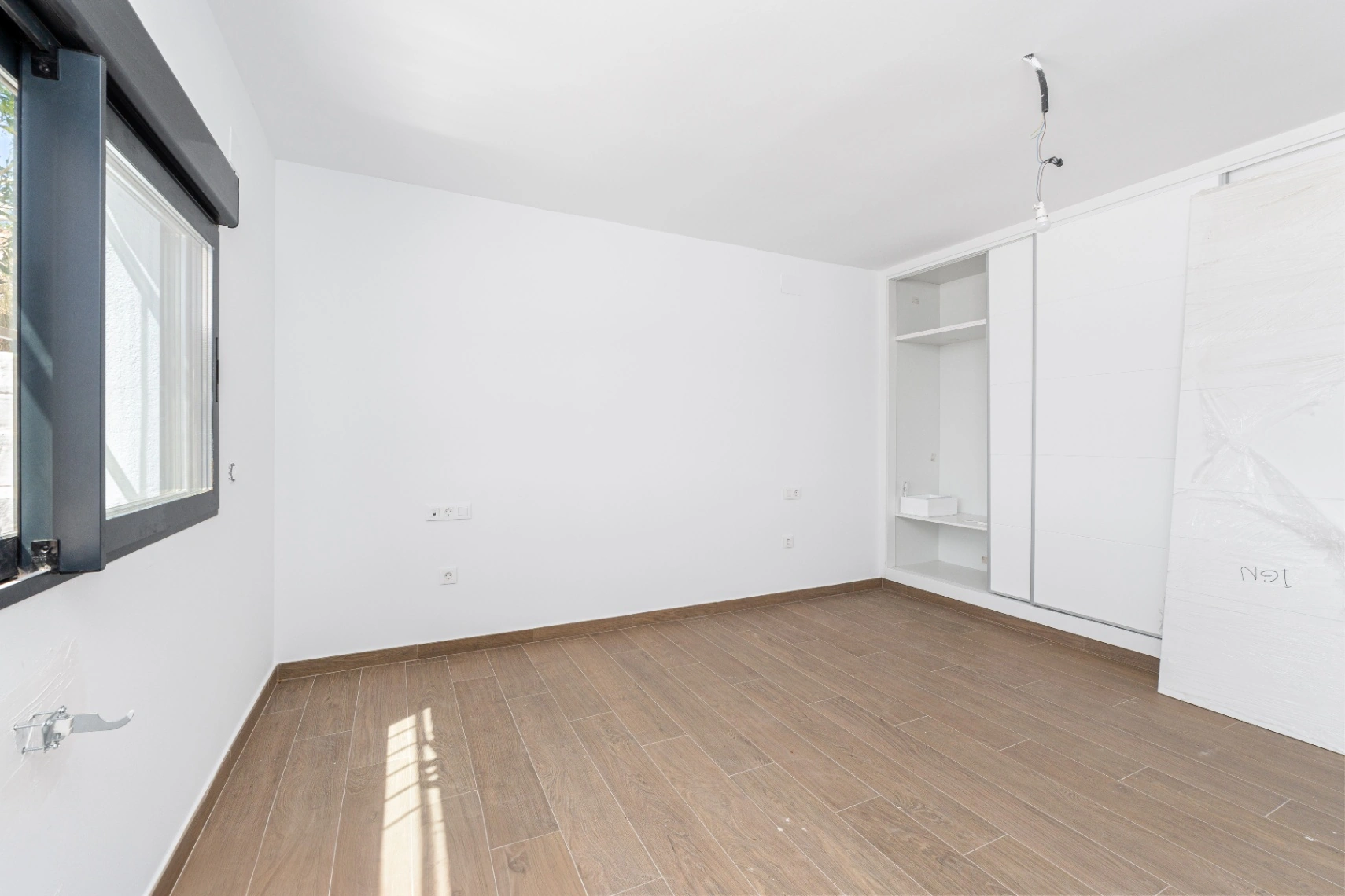 Modern and spacious villa for sale in La Nucía with large land and views.