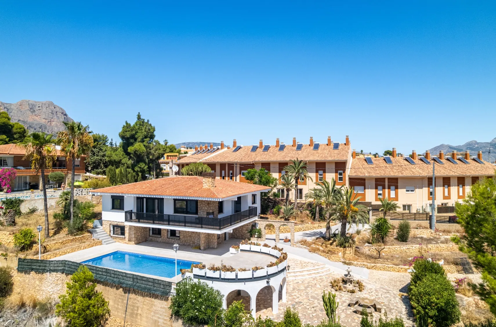 Modern and spacious villa for sale in La Nucía with large land and views.