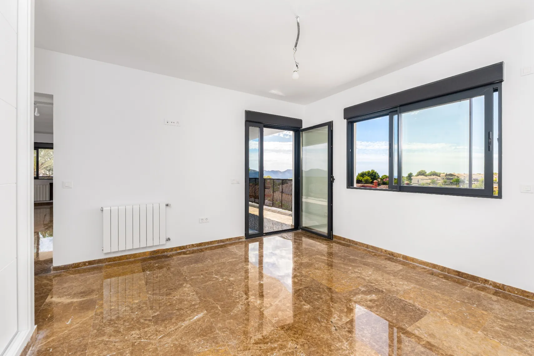 Modern and spacious villa for sale in La Nucía with large land and views.