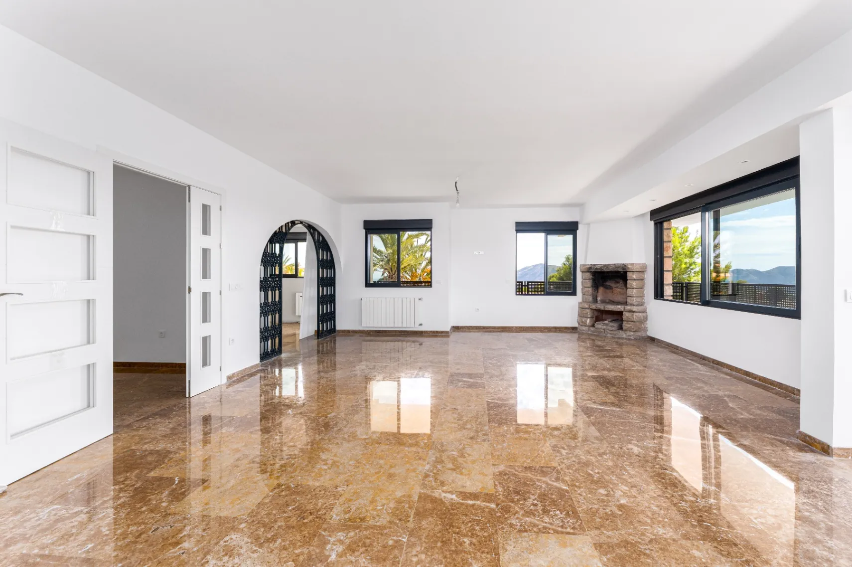 Modern and spacious villa for sale in La Nucía with large land and views.