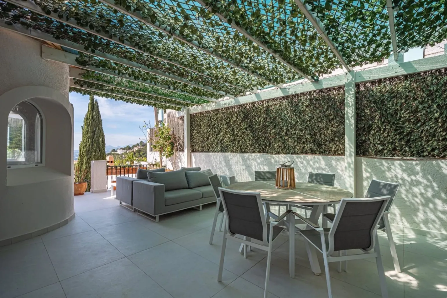 Elegant townhouse with panoramic sea views and dual terraces for sale in Altea Hills.