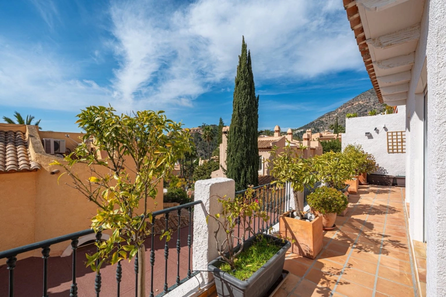Elegant townhouse with panoramic sea views and dual terraces for sale in Altea Hills.