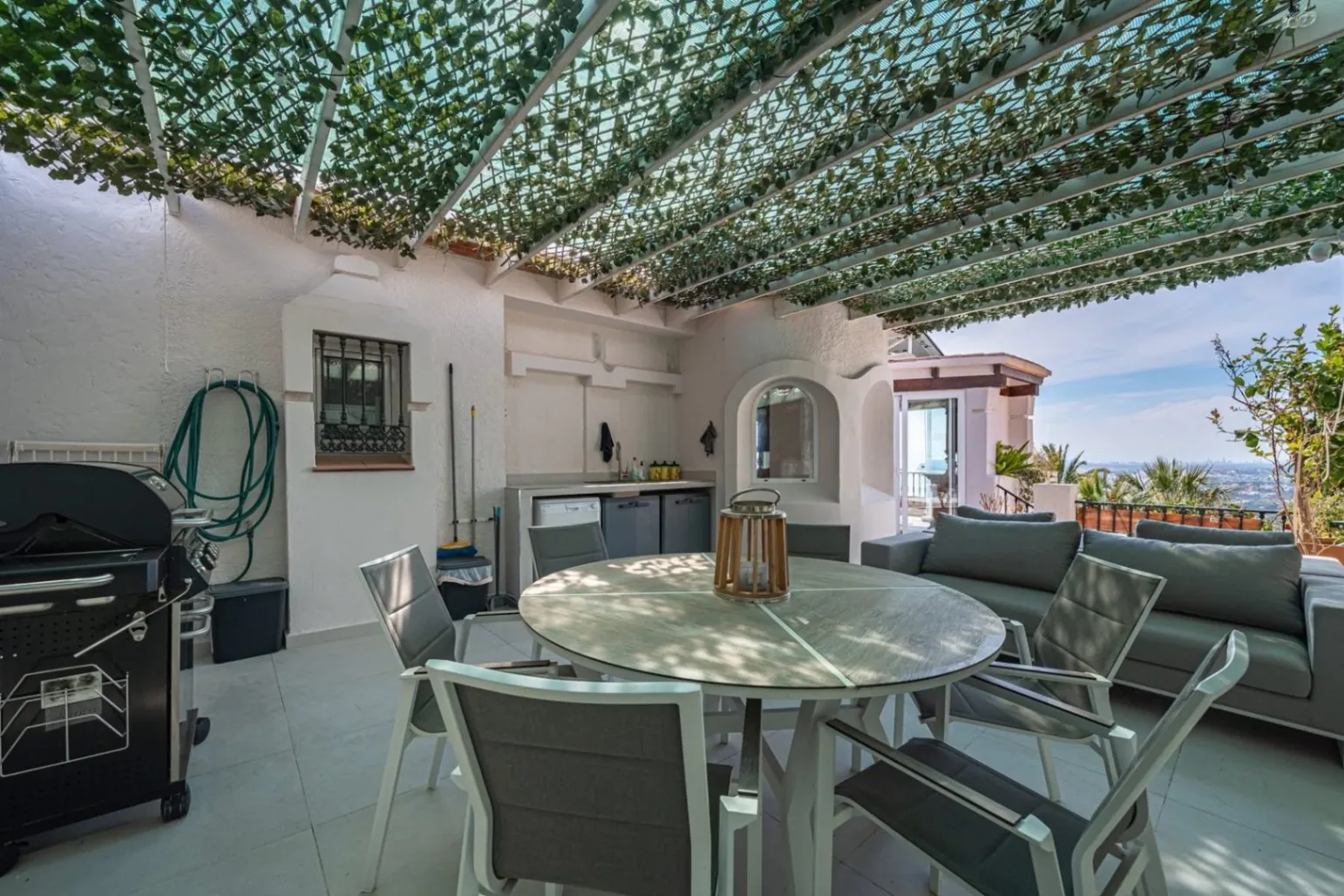 Elegant townhouse with panoramic sea views and dual terraces for sale in Altea Hills.