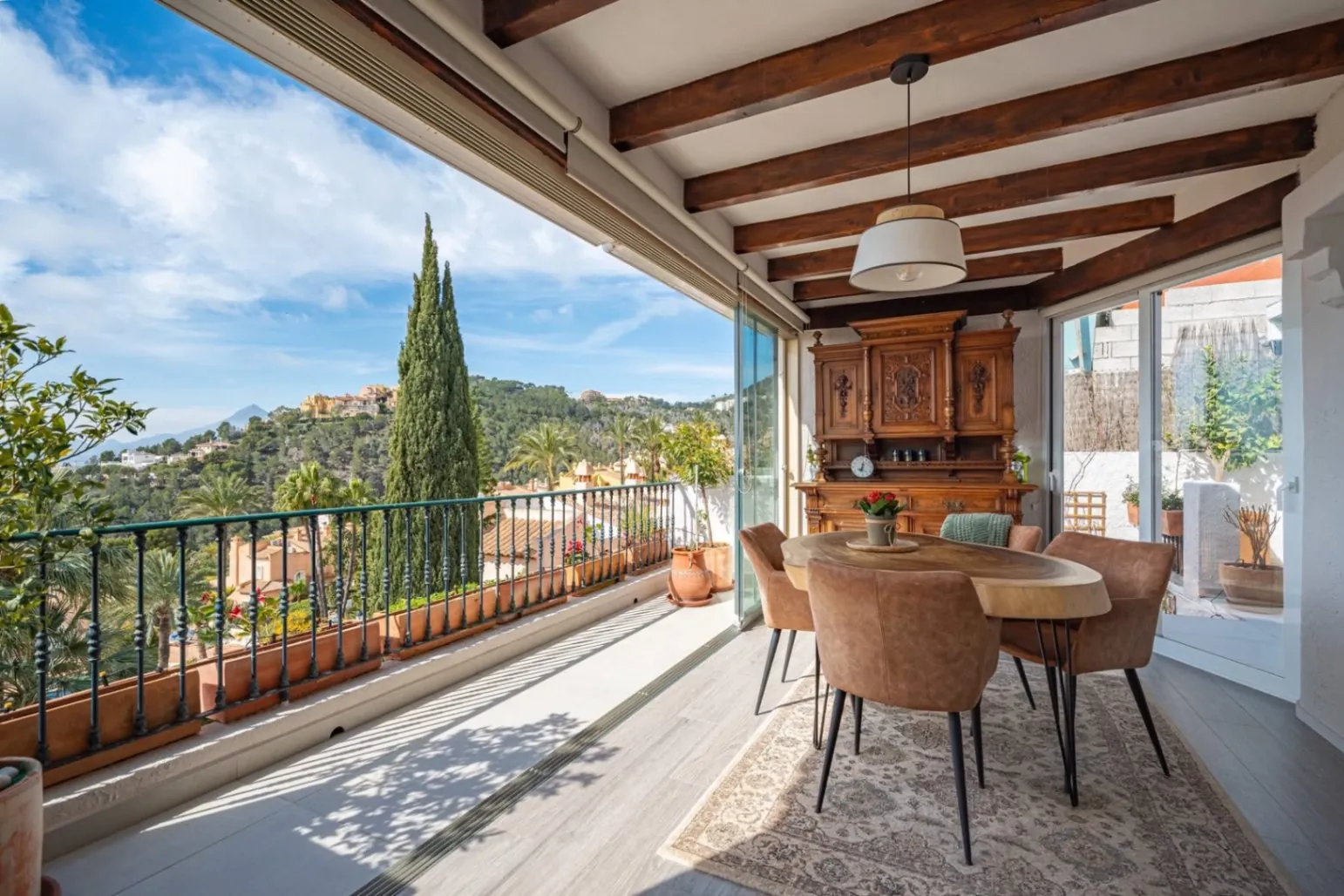 Elegant townhouse with panoramic sea views and dual terraces for sale in Altea Hills.