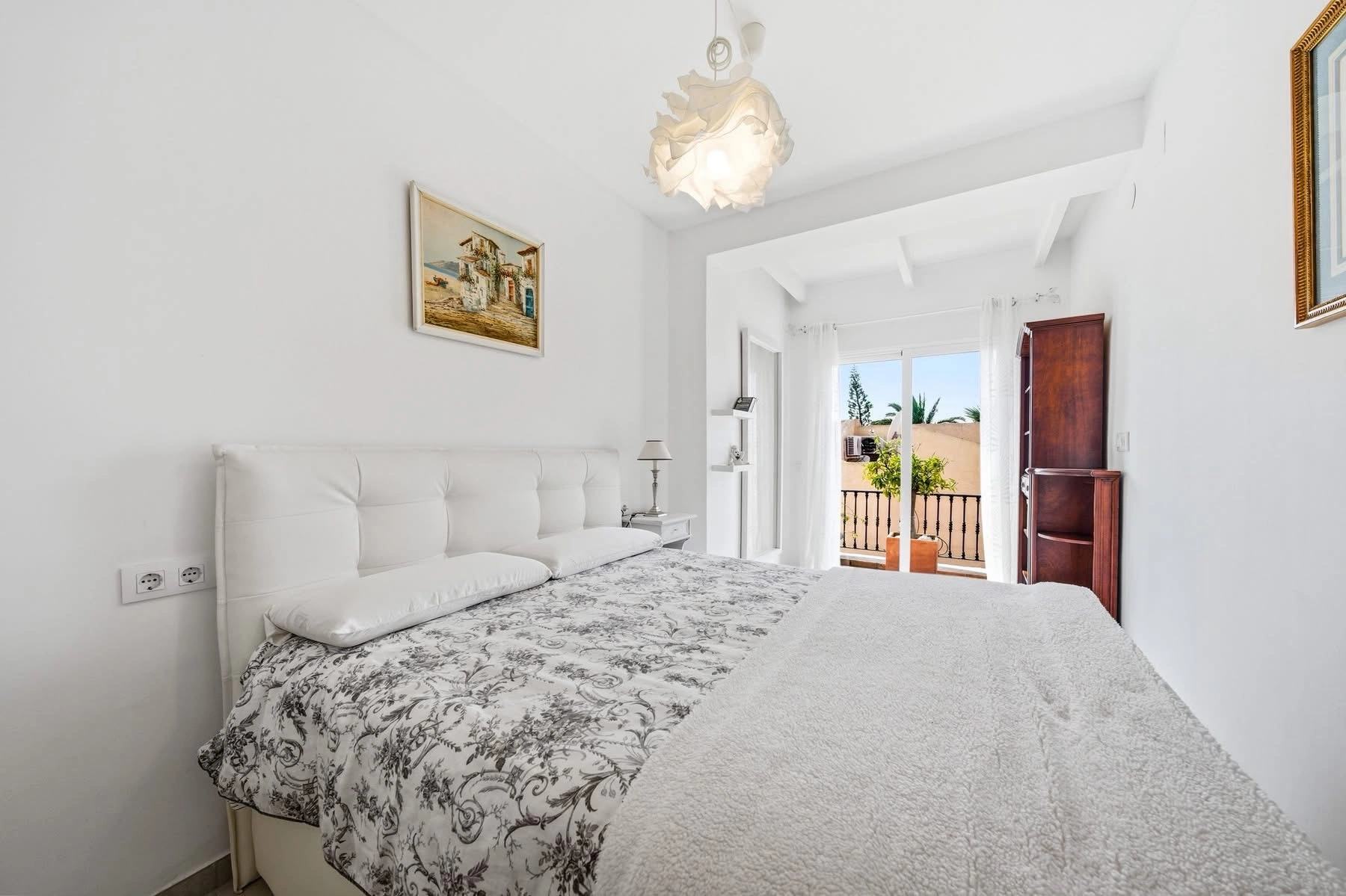 Elegant townhouse with panoramic sea views and dual terraces for sale in Altea Hills.