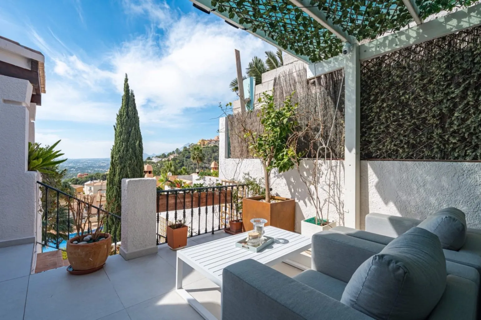Elegant townhouse with panoramic sea views and dual terraces for sale in Altea Hills.