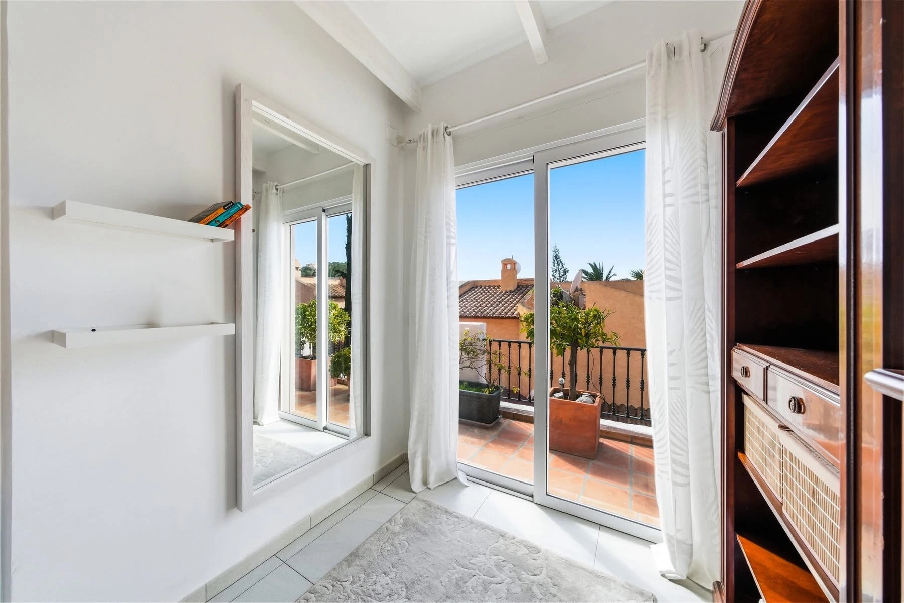 Elegant townhouse with panoramic sea views and dual terraces for sale in Altea Hills.