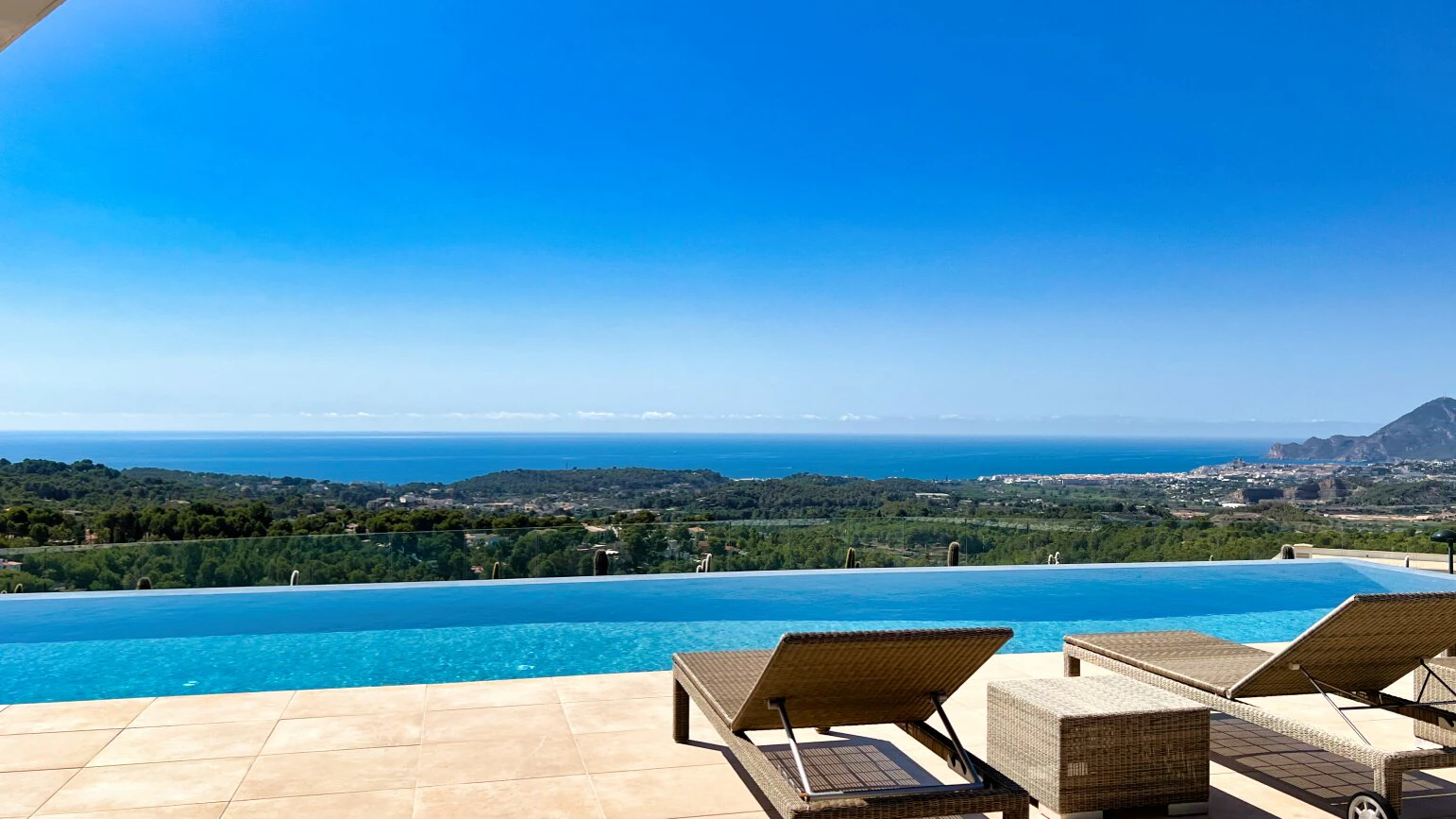 Luxury villa with heated infinity pool, guest apartment, and 180º sea views in Altea, Costa Blanca.