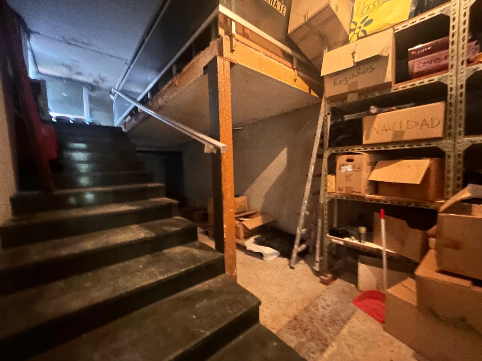 Commercial premises with a large storage area and shop at street level.