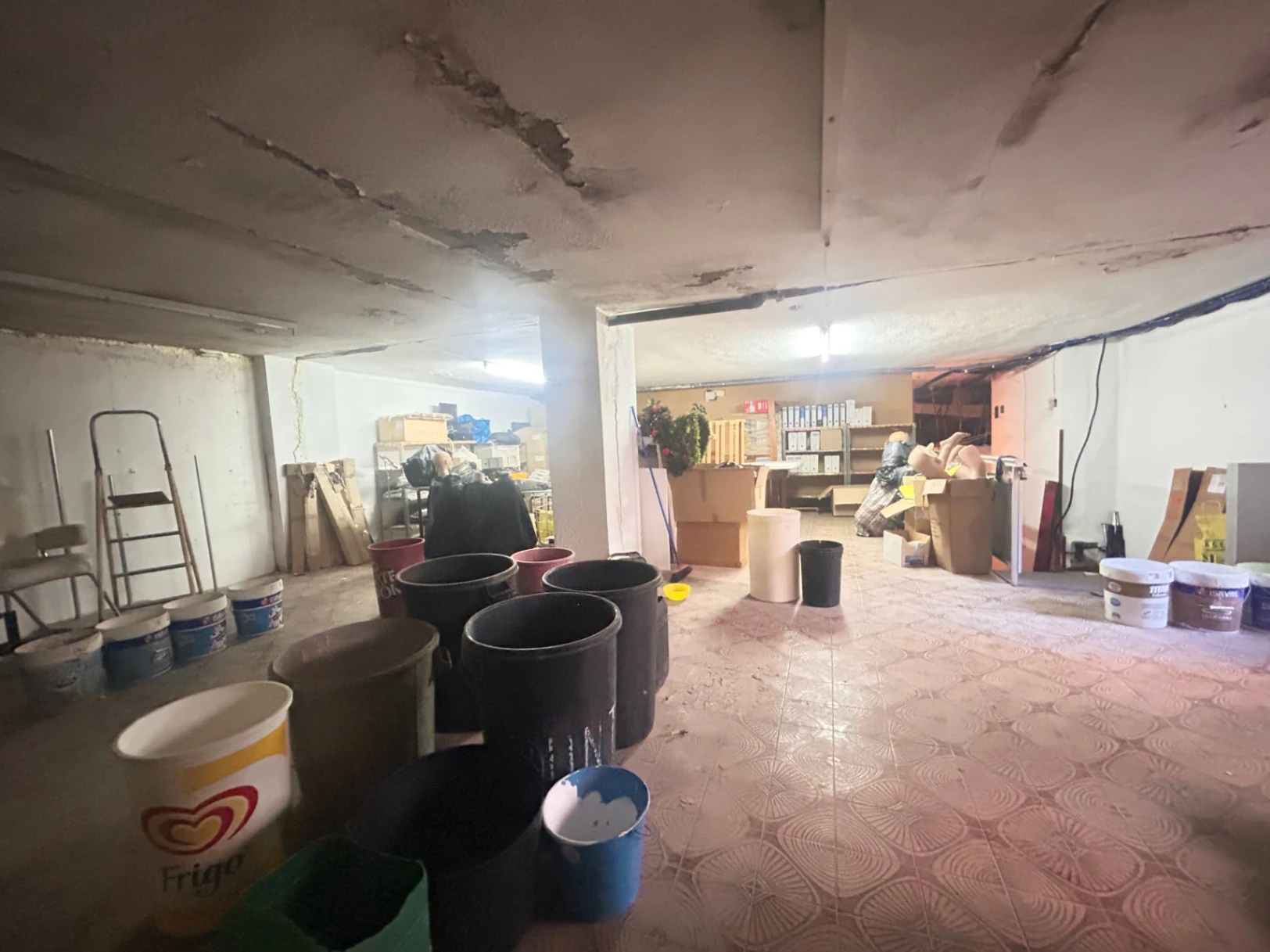 Commercial premises with a large storage area and shop at street level.
