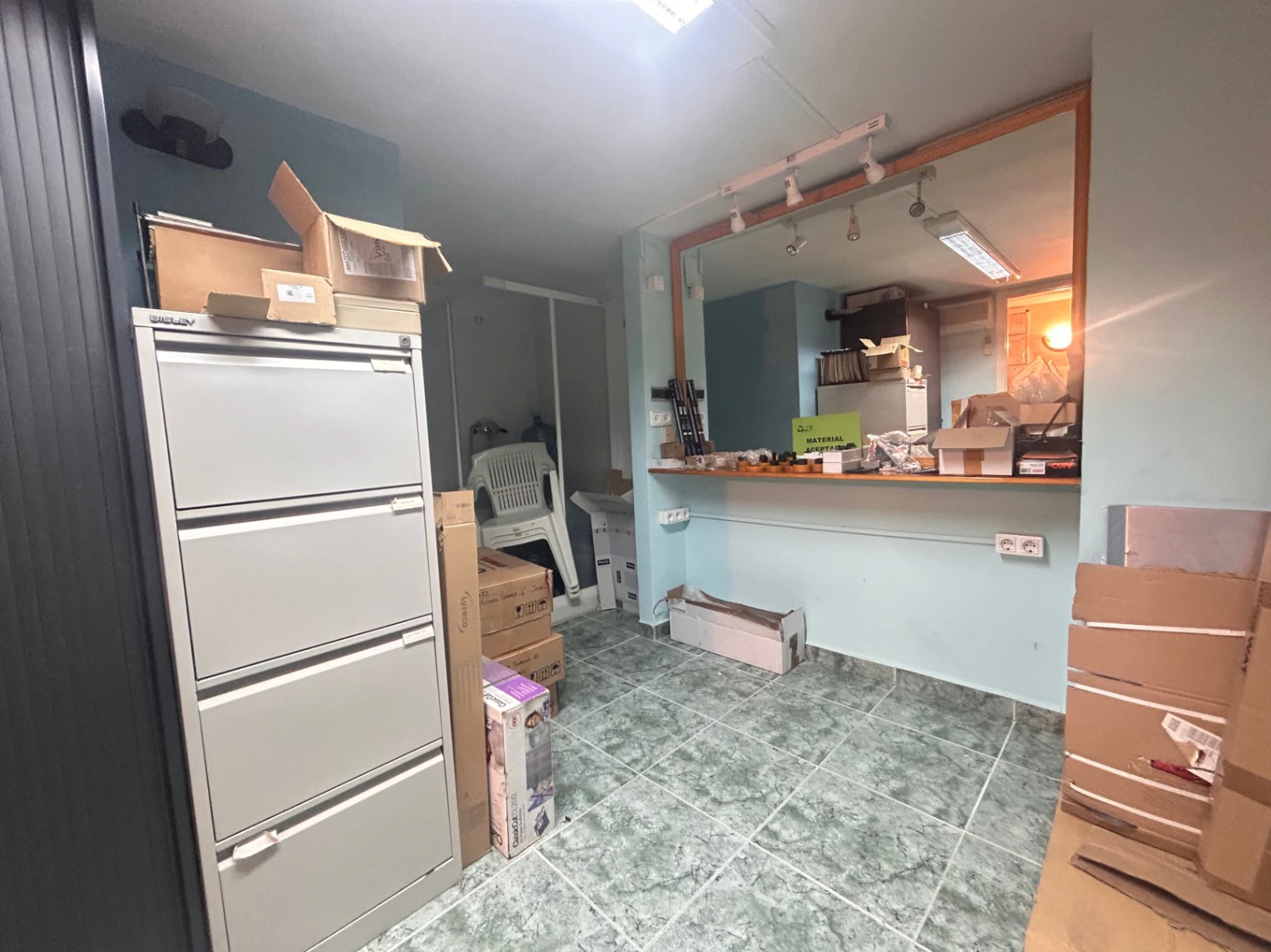Commercial premises with a large storage area and shop at street level.