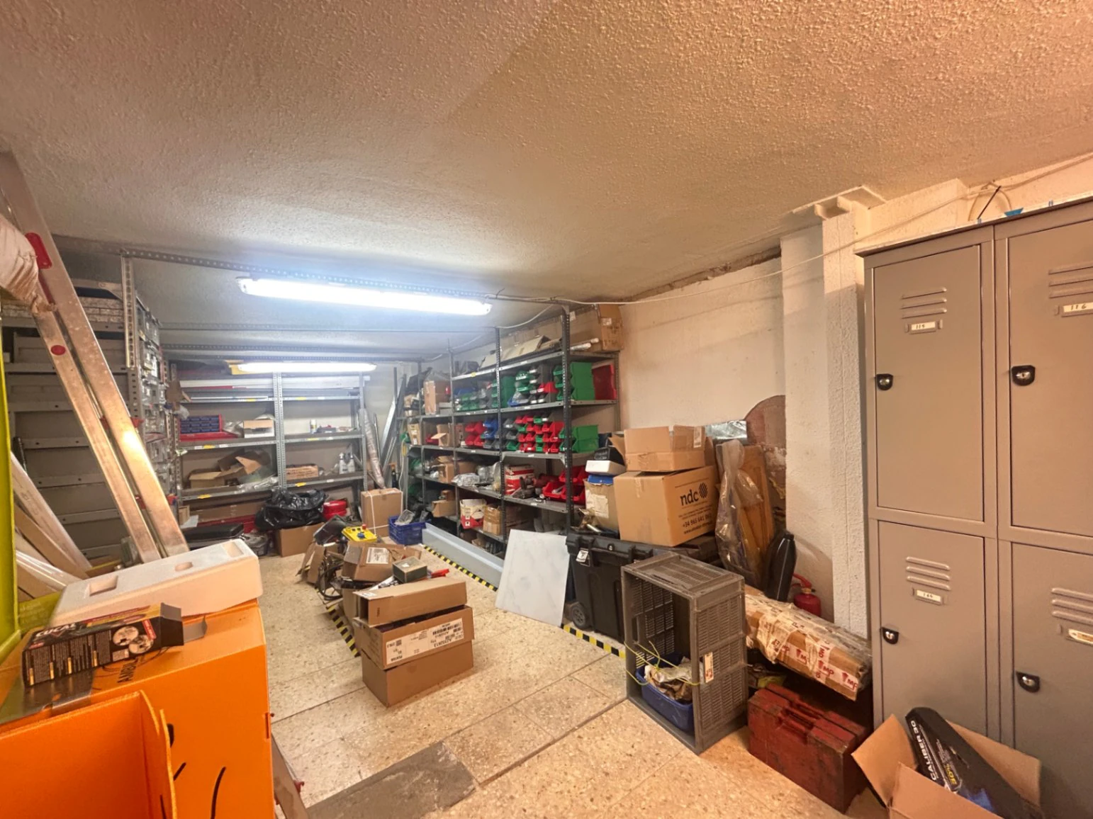 Commercial premises with a large storage area and shop at street level.