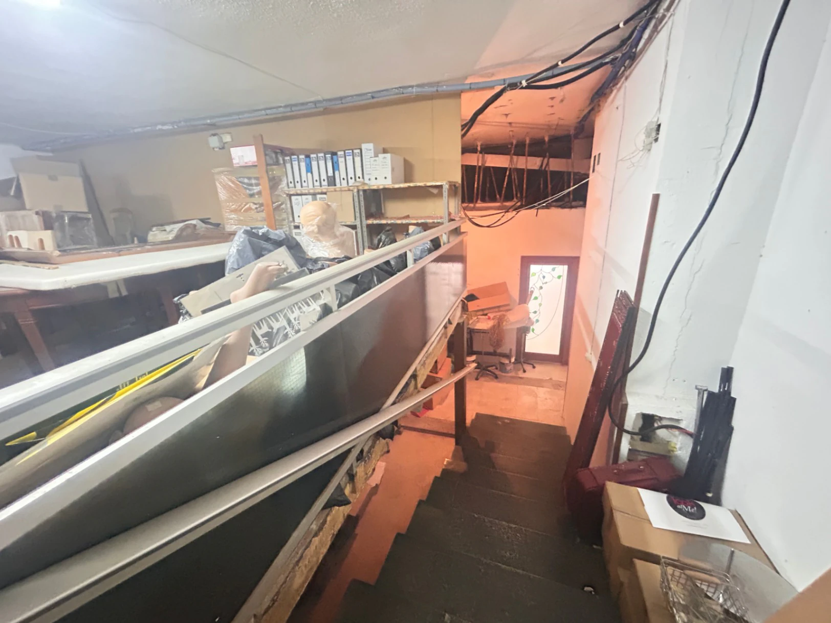 Commercial premises with a large storage area and shop at street level.