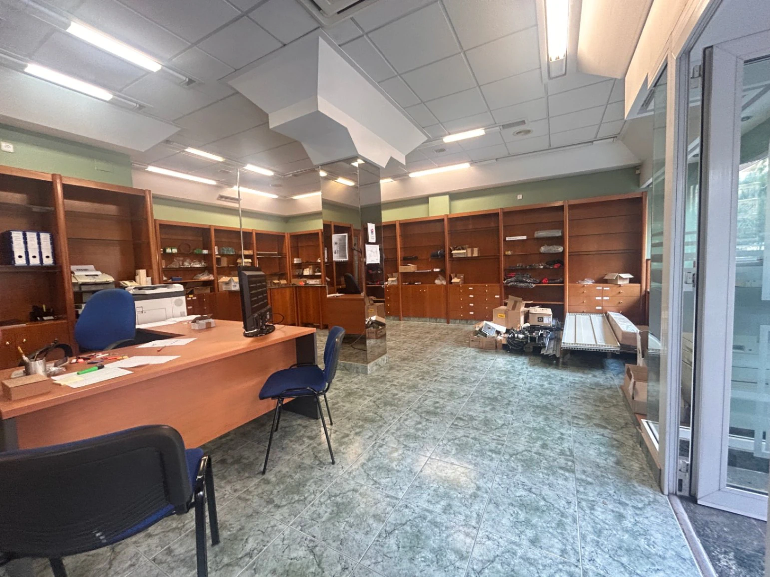 Commercial premises with a large storage area and shop at street level.