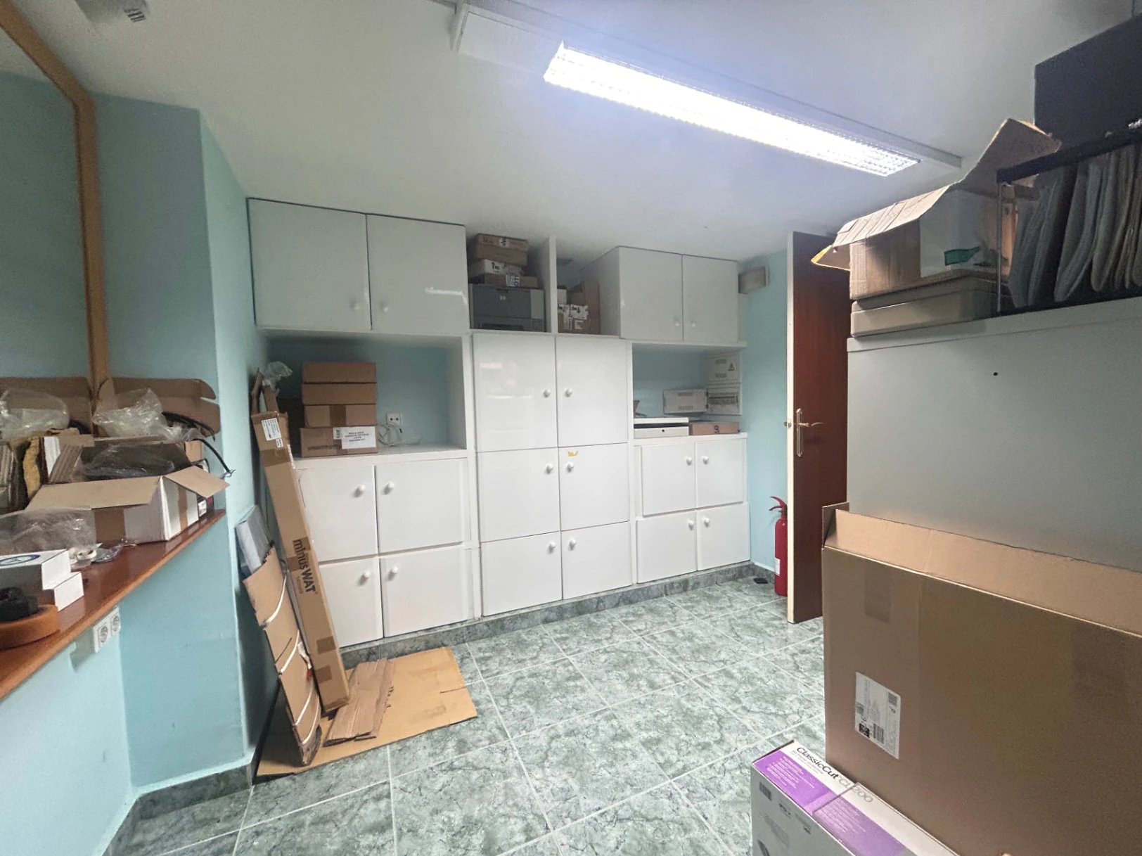 Commercial premises with a large storage area and shop at street level.