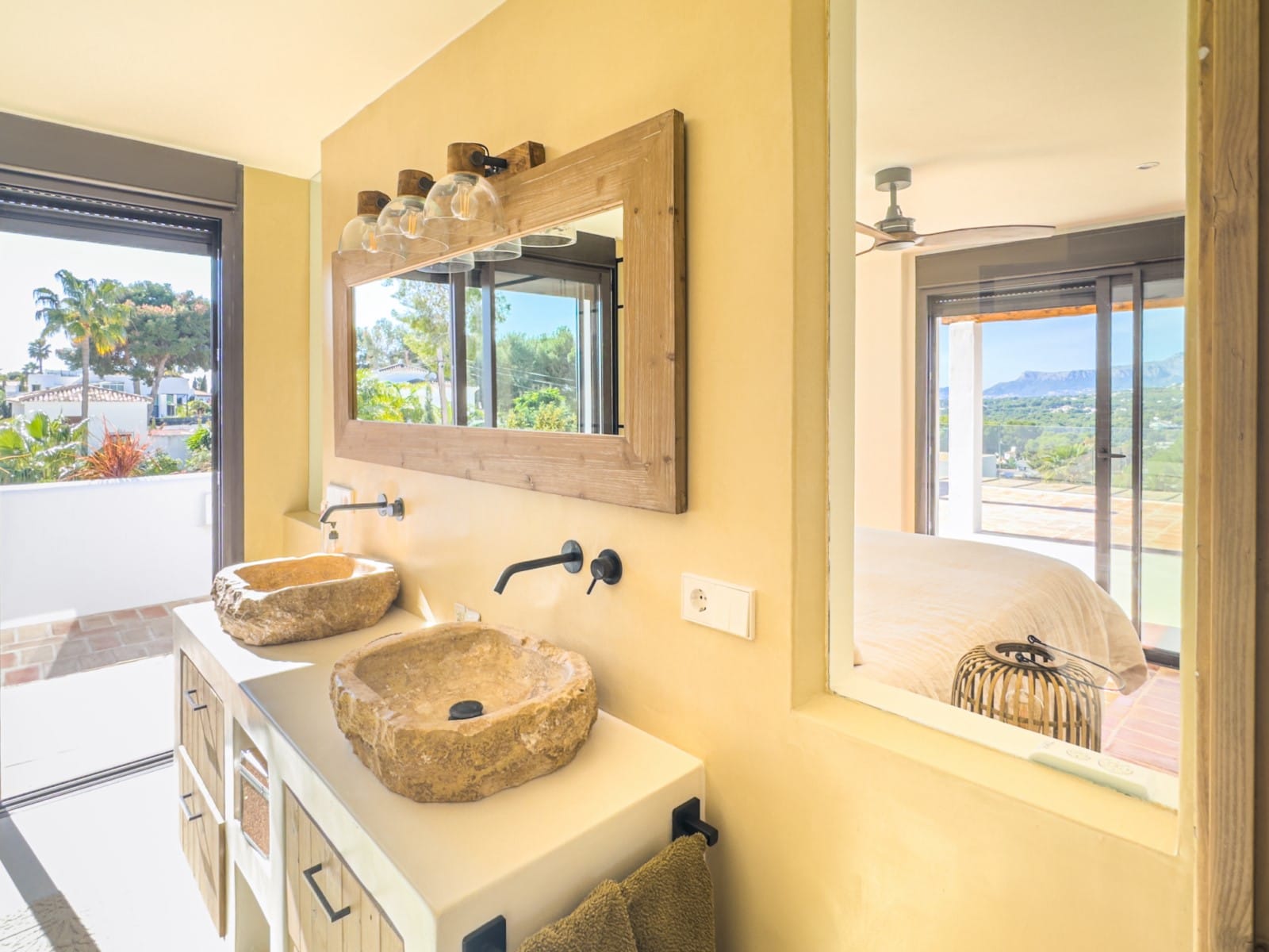 Ibizan-style villa with sea views for sale in Moraira, near El Portet and the Moraira Center.
