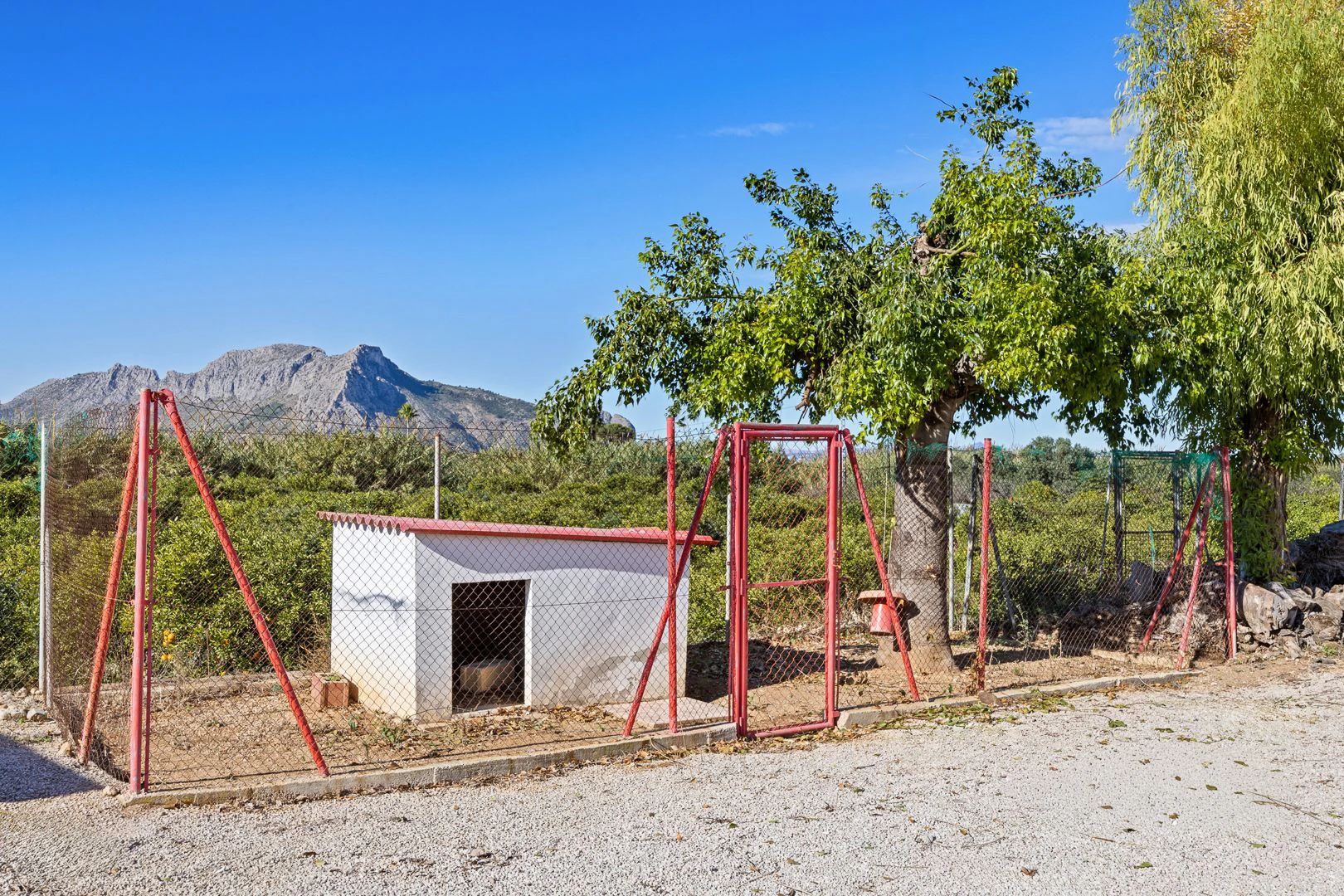 Large rustic estate comprising two houses and stables for horses.