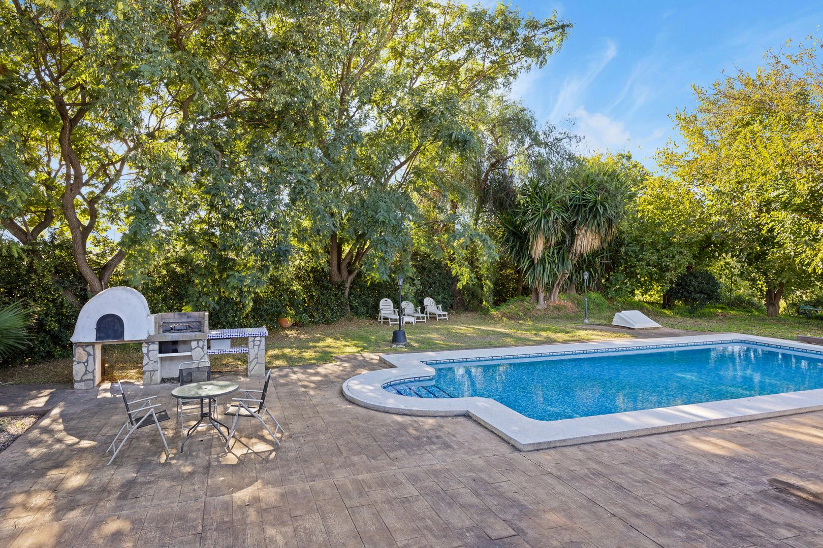 Large rustic estate comprising two houses and stables for horses.