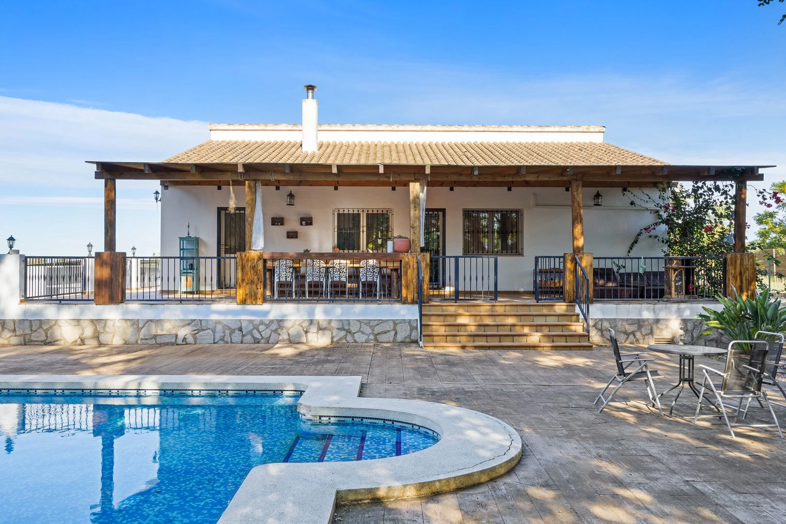 Large rustic estate comprising two houses and stables for horses.