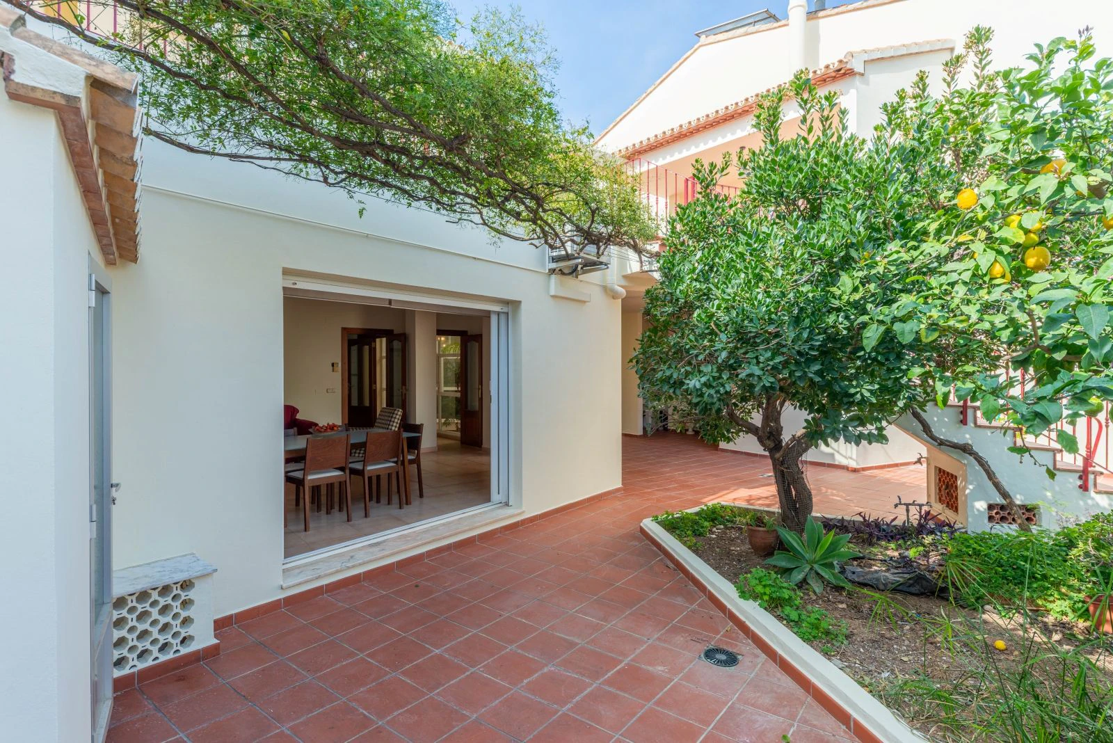 Spectacular village house with a large patio, barbecue, and garage.