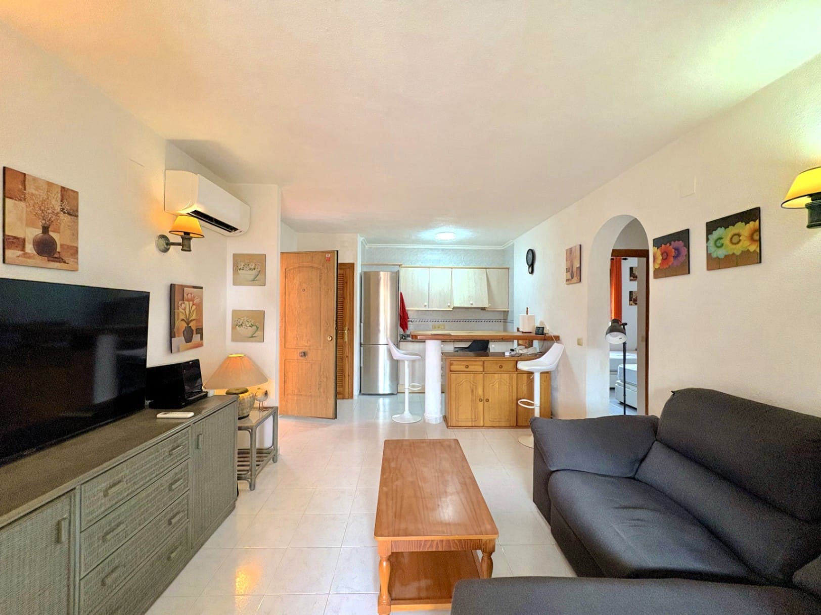 Appartement met gemeenschappelijk zwembad en tuin met gras