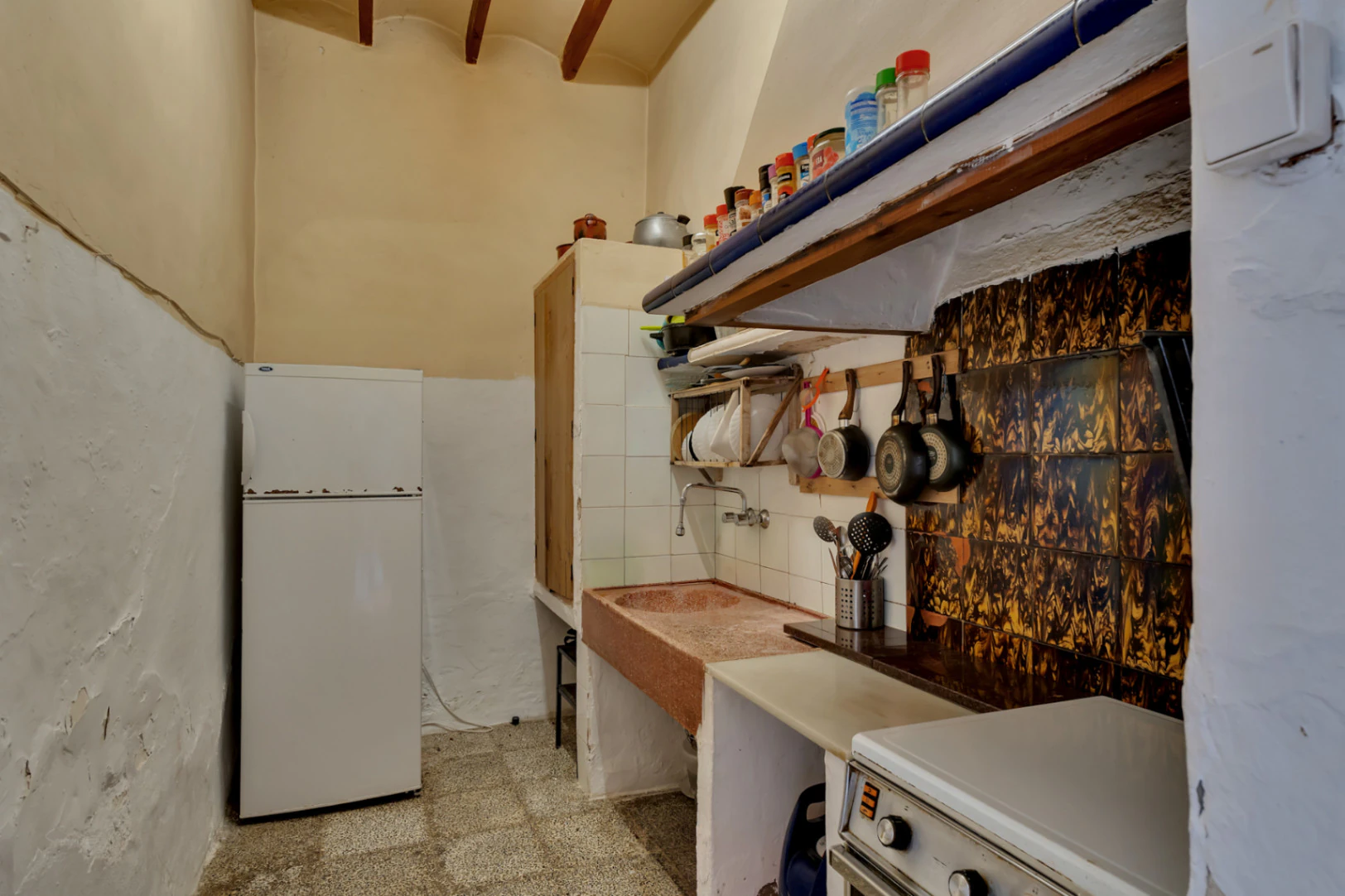 Village house with garage, spacious inner courtyard, and potential to expand the property.