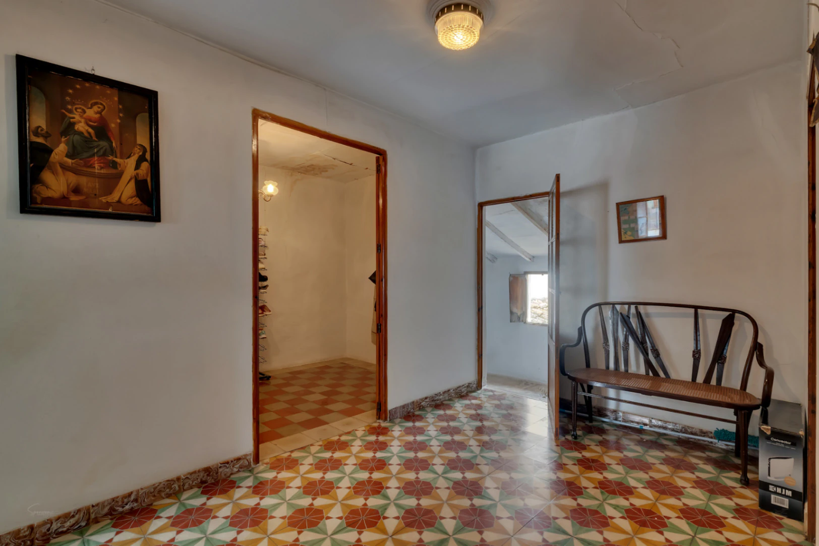 Village house with garage, spacious inner courtyard, and potential to expand the property.