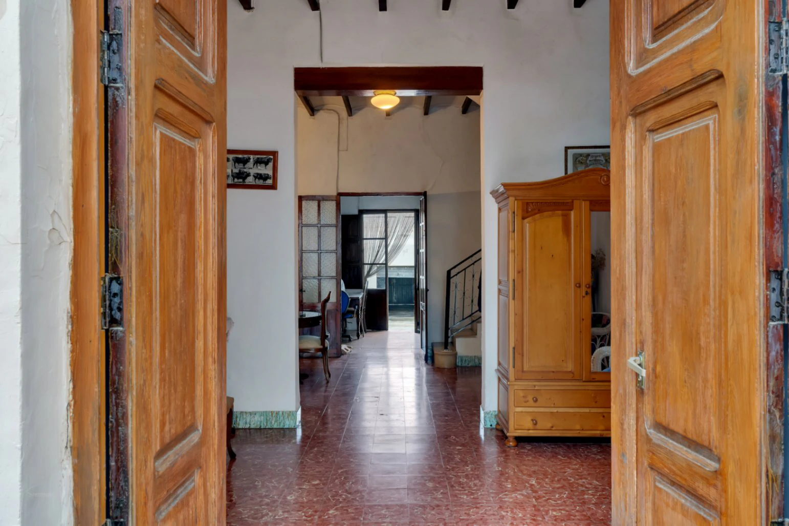 Village house with garage, spacious inner courtyard, and potential to expand the property.